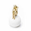 Figure Sitting on White Ball